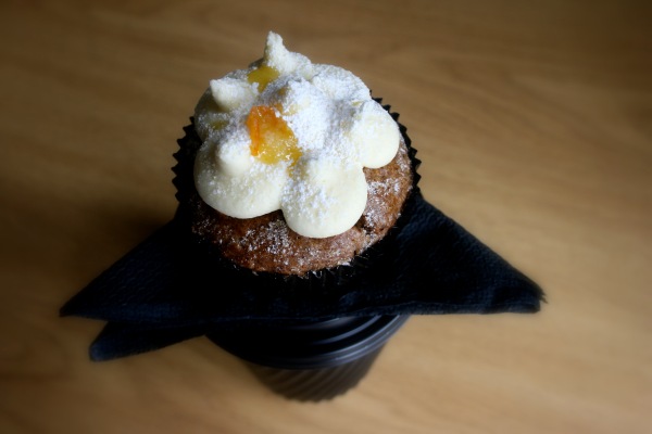 Carrot cupcake with orange cream cheese frosting. Dinky and delicious! 
